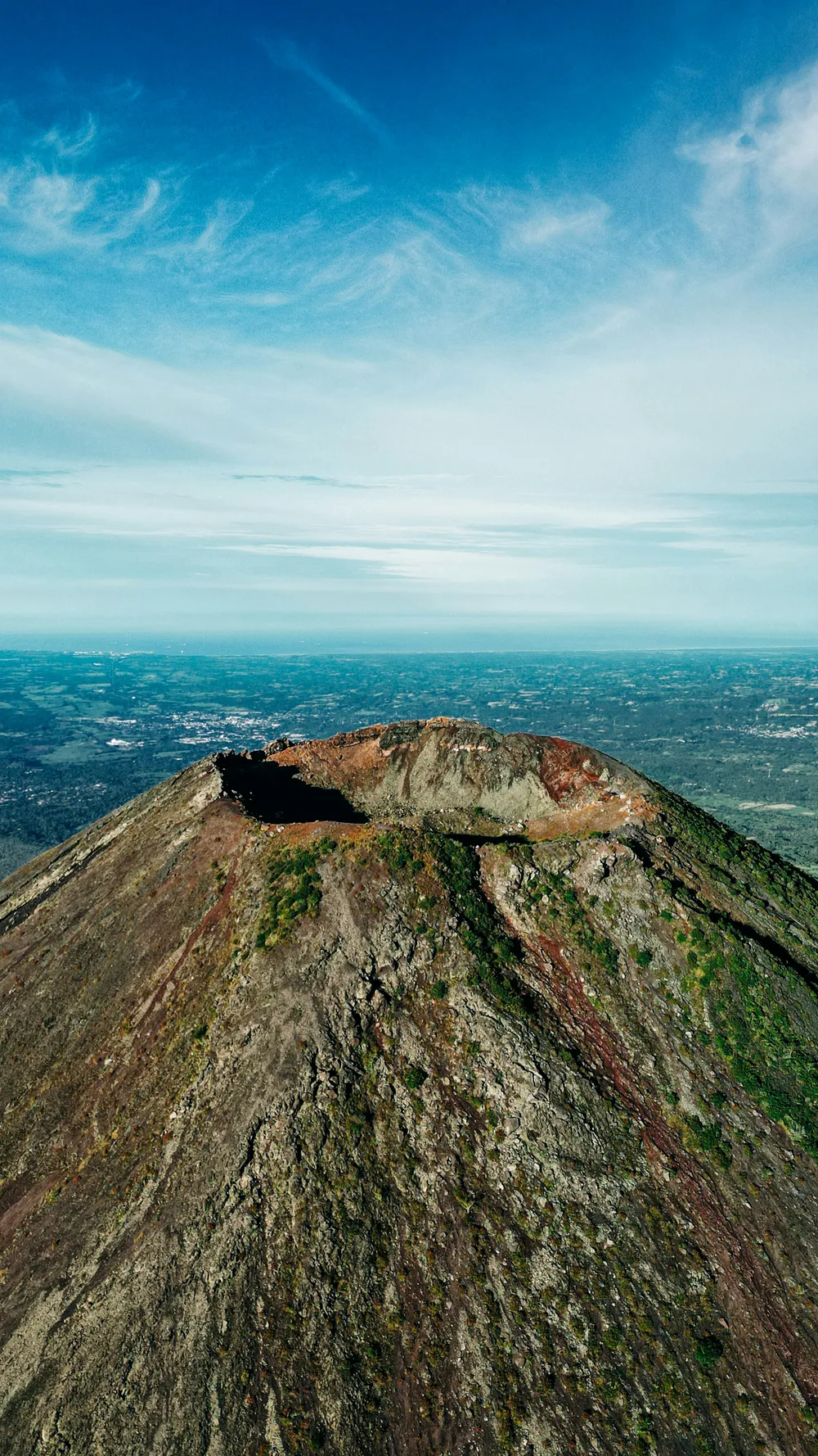A volcanic peak rising above the green landscape of El Salvador